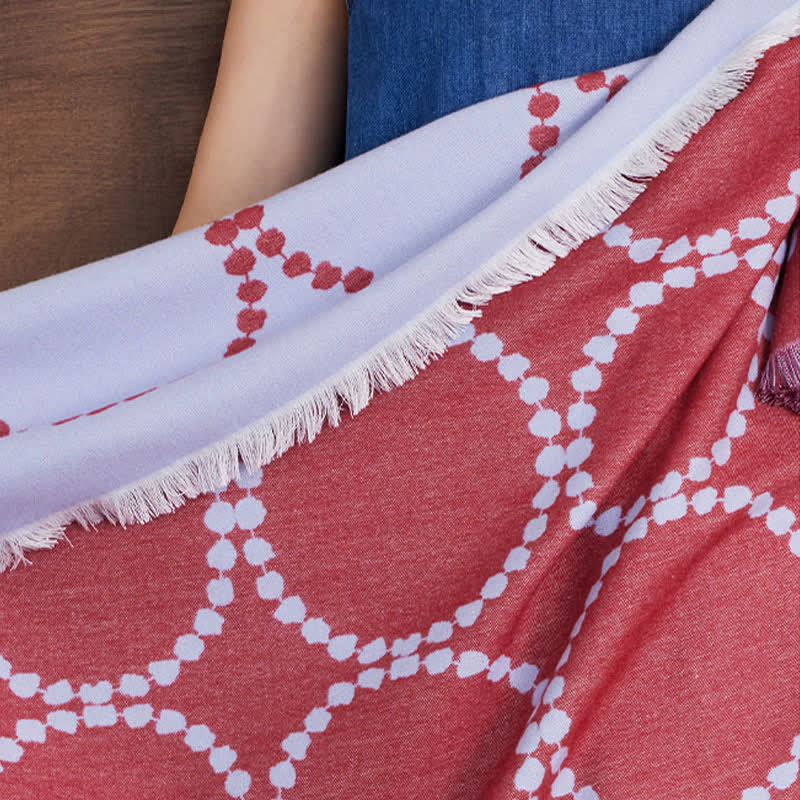Coperta reversibile con motivo a cerchi e nappe - image 14