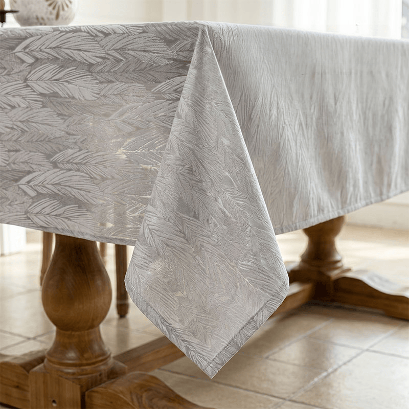 Tovaglia jacquard con motivo a foglie - image 7