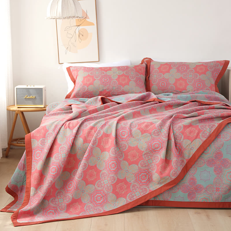 Trapunta reversibile in garza di cotone con motivo patchwork a fiori