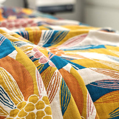 Trapunta reversibile in cotone con stampa a fiori gialli Ownkoti