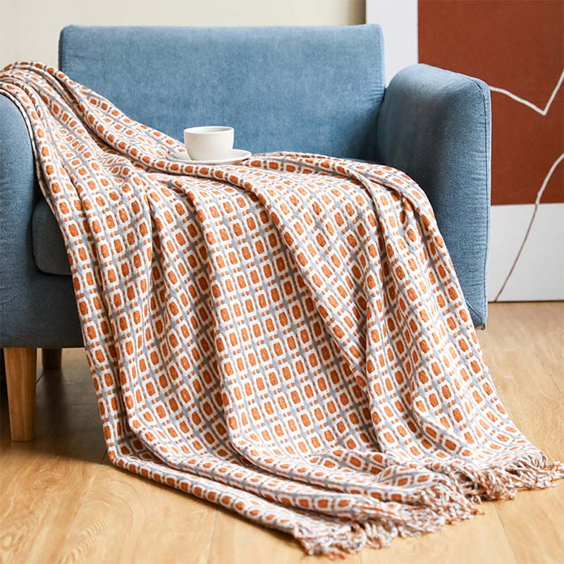 Coperta per divano lavorata a maglia Ownkoti con nappe