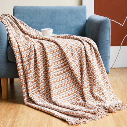 Coperta per divano lavorata a maglia Ownkoti con nappe