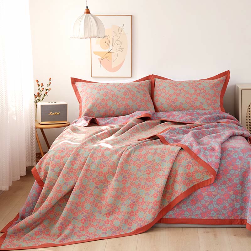 Trapunta reversibile in garza di cotone jacquard floreale
