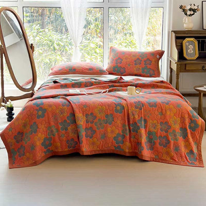 Trapunta reversibile in cotone jacquard con splendido motivo floreale