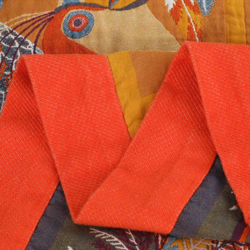Trapunta reversibile in cotone morbido con motivo tucano