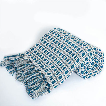 Coperta per divano lavorata a maglia Ownkoti con nappe