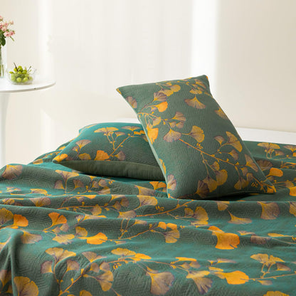 Trapunta reversibile in cotone jacquard con foglie di ginkgo