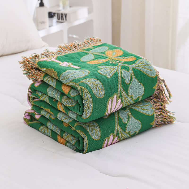 Coperta reversibile in garza di cotone con nappe floreali