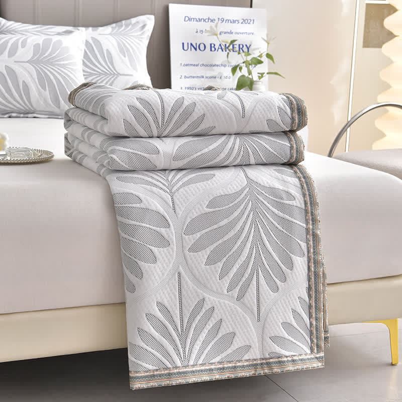 Trapunta traspirante con foglie in jacquard