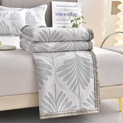 Trapunta traspirante con foglie in jacquard