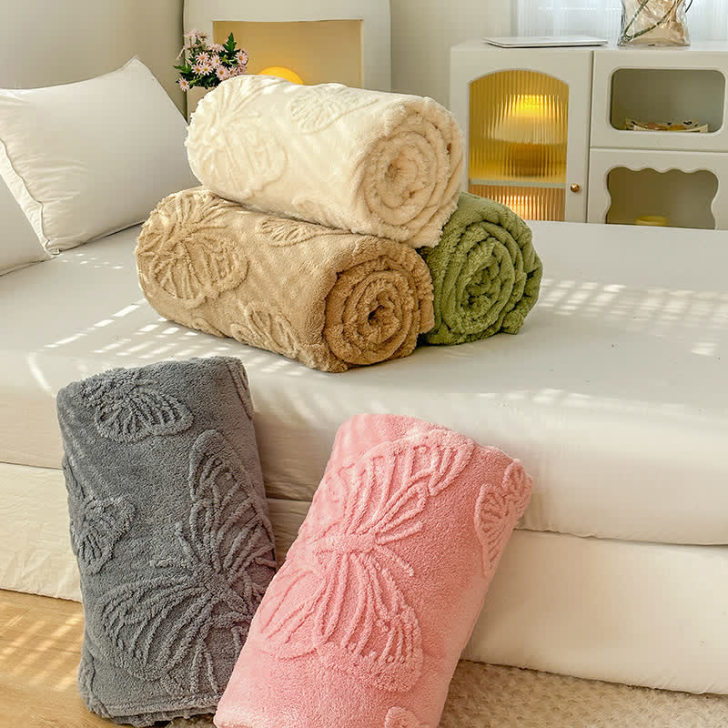 Coperta in pile reversibile con motivo a farfalla in tinta unita