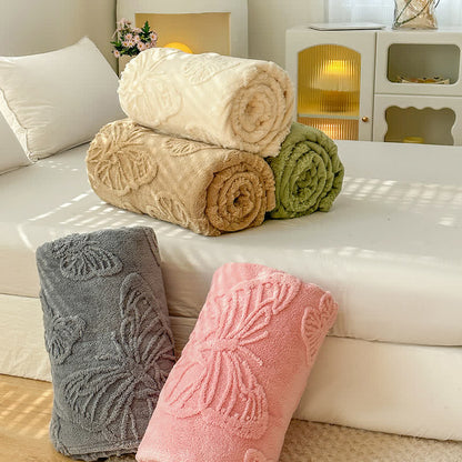 Coperta in pile reversibile con motivo a farfalla in tinta unita