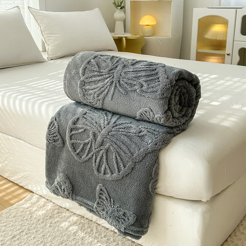 Coperta in pile reversibile con motivo a farfalla in tinta unita