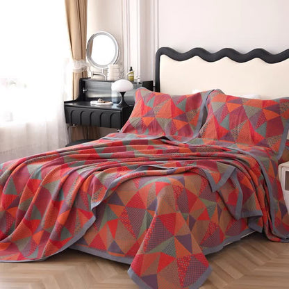 Trapunta reversibile in cotone biologico triangolare Jacquard