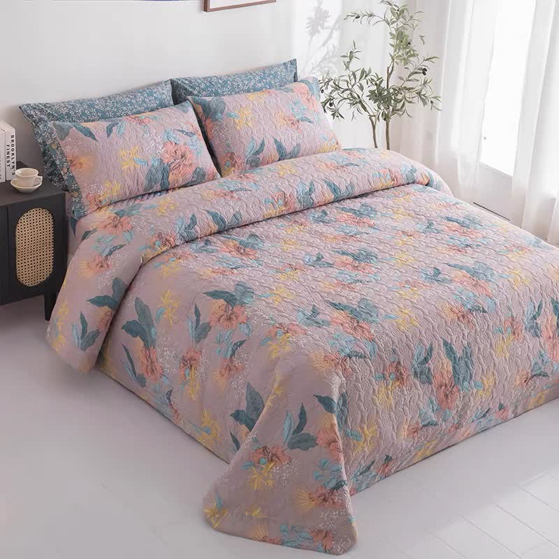 Elegante biancheria da letto trapuntata in puro cotone con motivo floreale