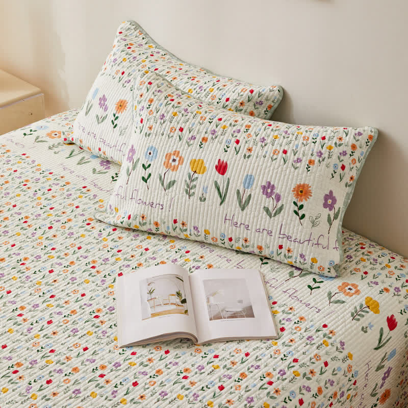 Biancheria da letto trapuntata in puro cotone con motivi floreali colorati