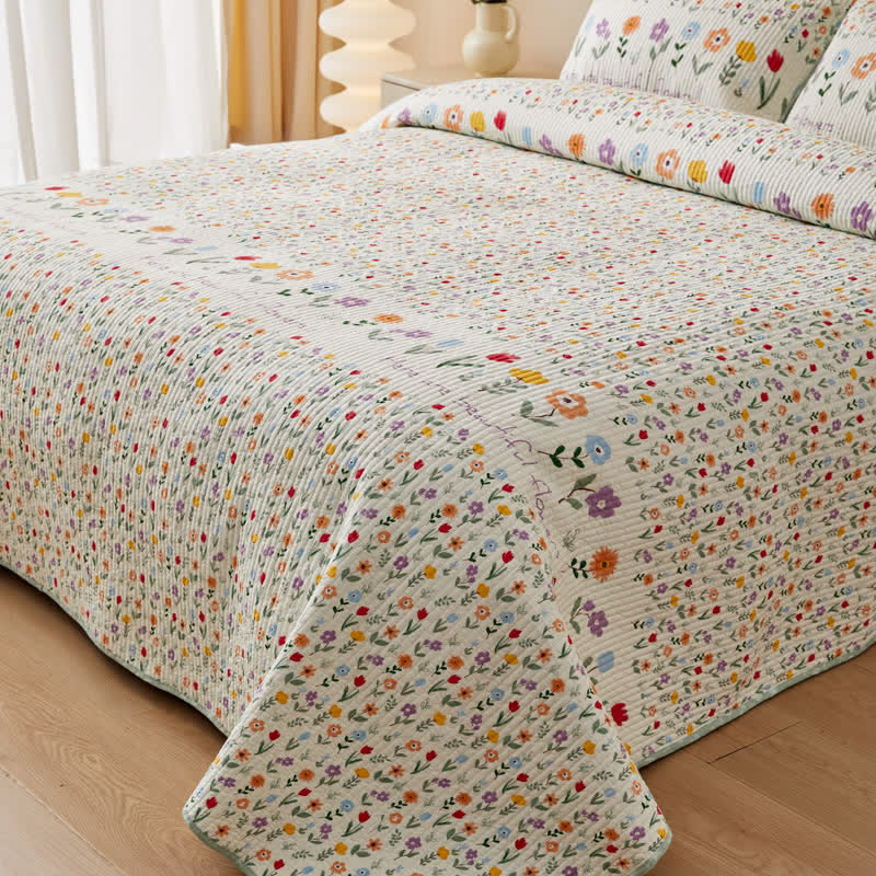Biancheria da letto trapuntata in puro cotone con motivi floreali colorati