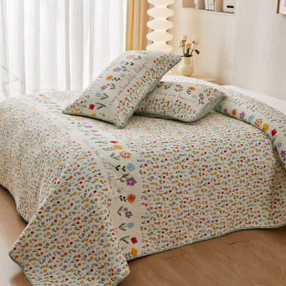 Biancheria da letto trapuntata in puro cotone con motivi floreali colorati