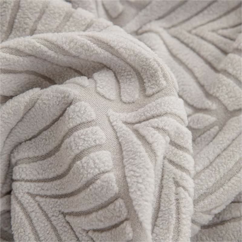 Copridivano con trama a foglia jacquard tinta unita