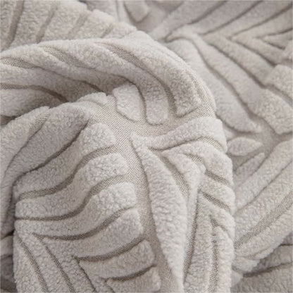 Copridivano con trama a foglia jacquard tinta unita