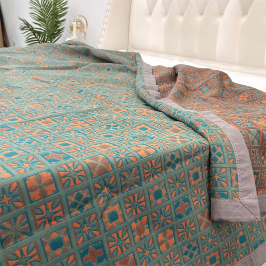 Trapunta reversibile in puro cotone a quadri e fiori