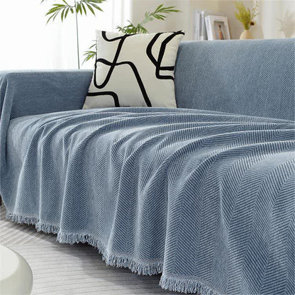 Copridivano in ciniglia a spina di pesce con nappe - image 0