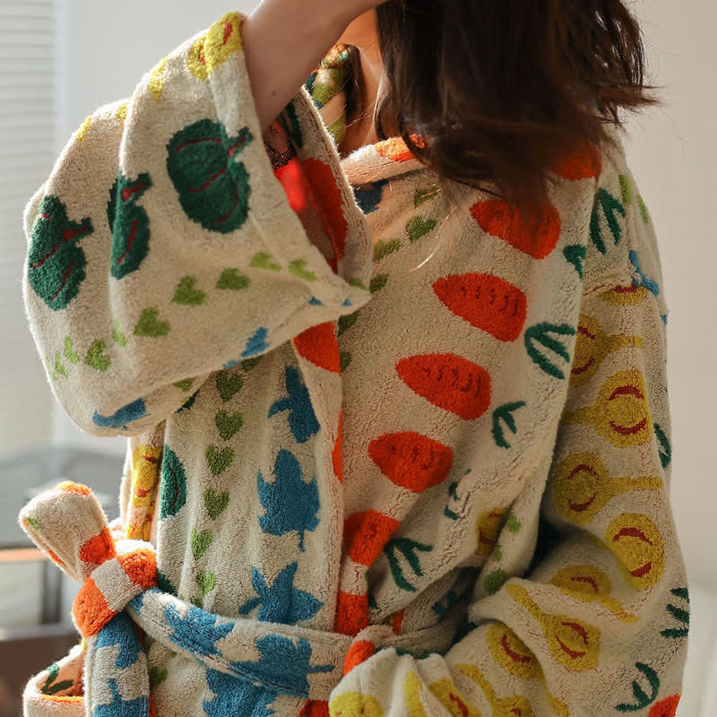 Accappatoio con cappuccio in cotone con motivo vegetale colorato