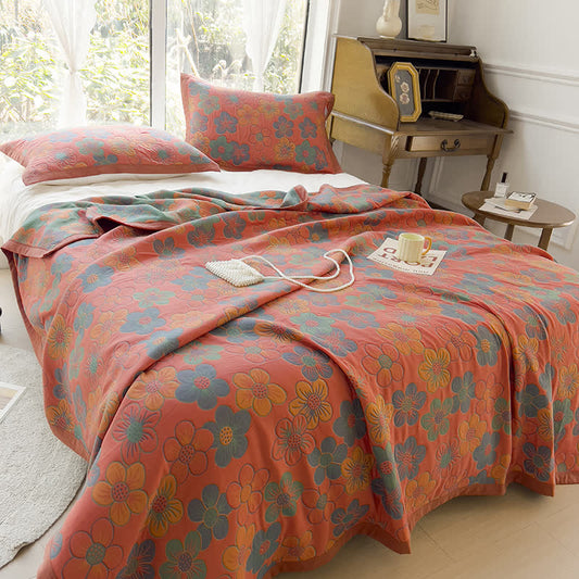 Trapunta reversibile in cotone jacquard con splendido motivo floreale