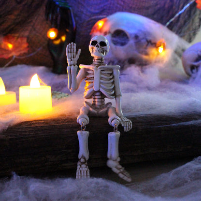 Ornamento di Halloween in resina con scheletro che saluta con la mano