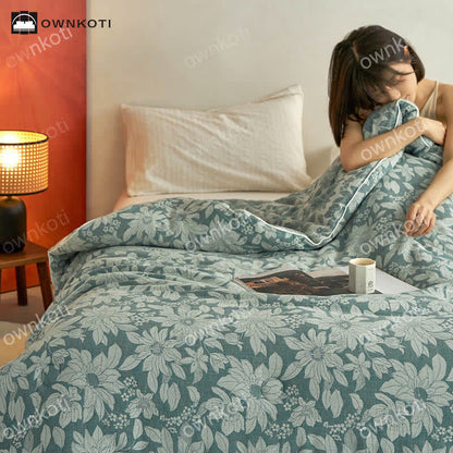 Trapunta floreale in cotone jacquard tinto in filo