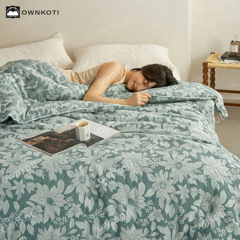 Trapunta floreale in cotone jacquard tinto in filo