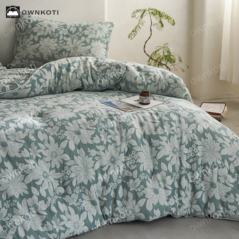 Trapunta floreale in cotone jacquard tinto in filo
