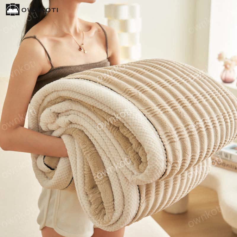 Coperta in pile con trama a onde jacquard