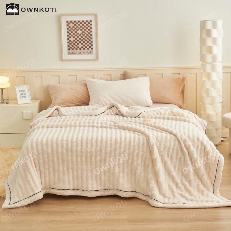Coperta in pile con trama a onde jacquard