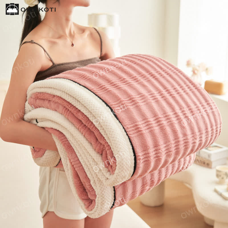 Coperta in pile con trama a onde jacquard