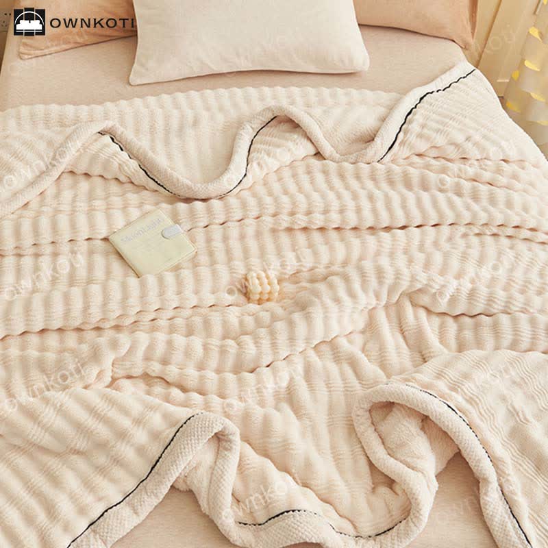 Coperta in pile con trama a onde jacquard