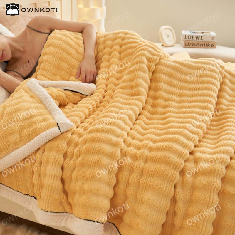 Coperta in pile con trama a onde jacquard