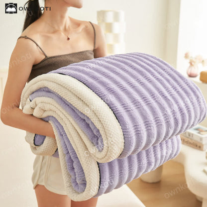 Coperta in pile con trama a onde jacquard