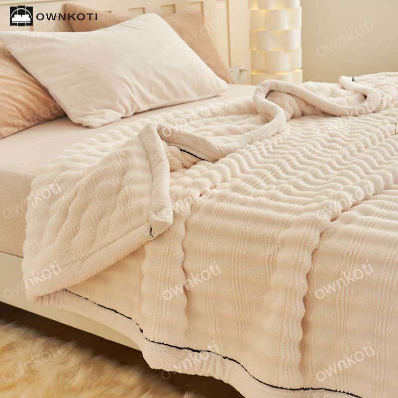 Coperta in pile con trama a onde jacquard