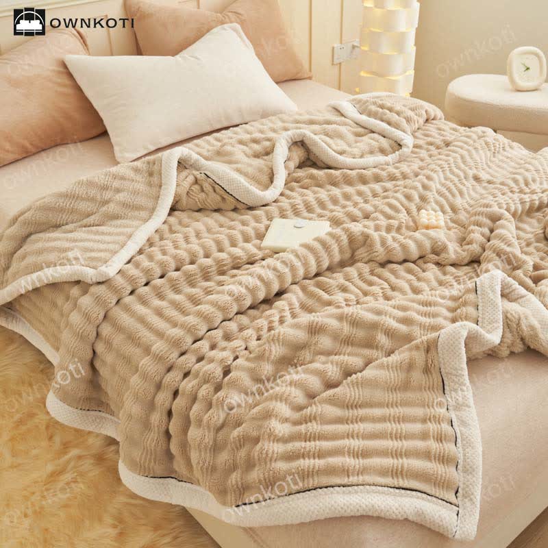 Coperta in pile con trama a onde jacquard