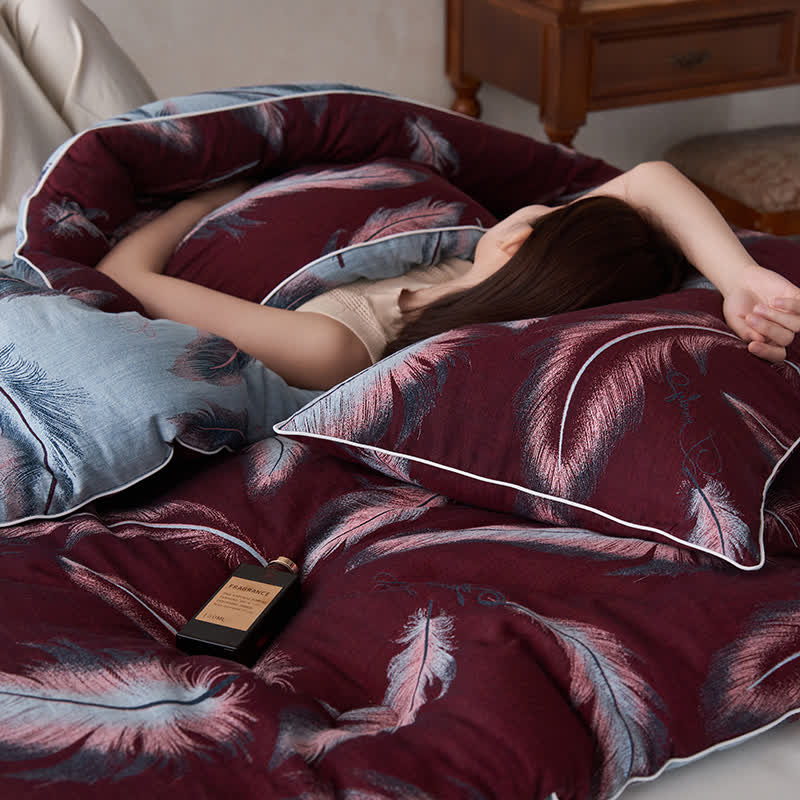 Trapunta in cotone e cashmere con piume jacquard