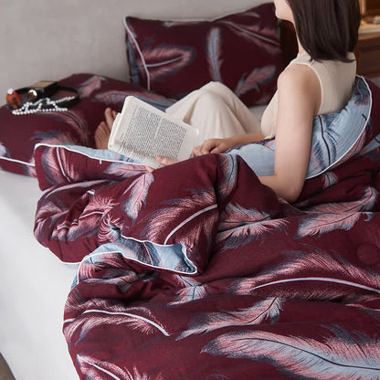 Trapunta in cotone e cashmere con piume jacquard