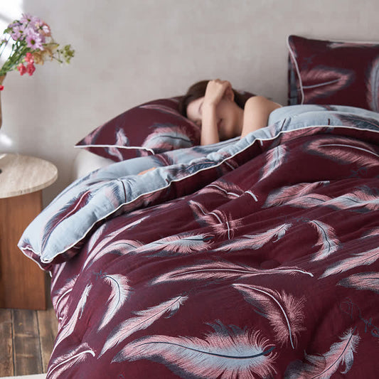 Trapunta in cotone e cashmere con piume jacquard