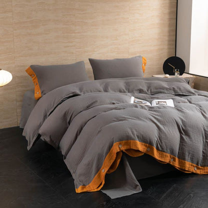 Set di biancheria da letto con bottoni in garza di cotone tinta unita (4 pezzi)