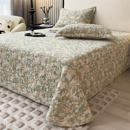 Copriletto trapuntato in garza di cotone con motivo floreale jacquard