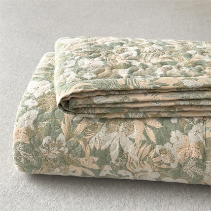 Copriletto trapuntato in garza di cotone con motivo floreale jacquard