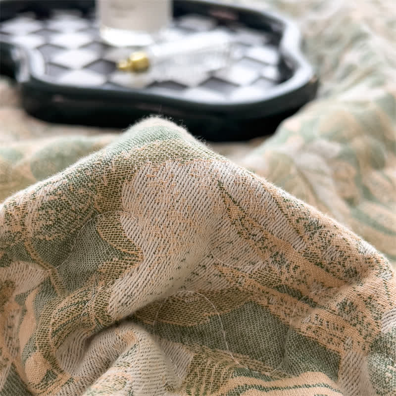 Copriletto trapuntato in garza di cotone con motivo floreale jacquard