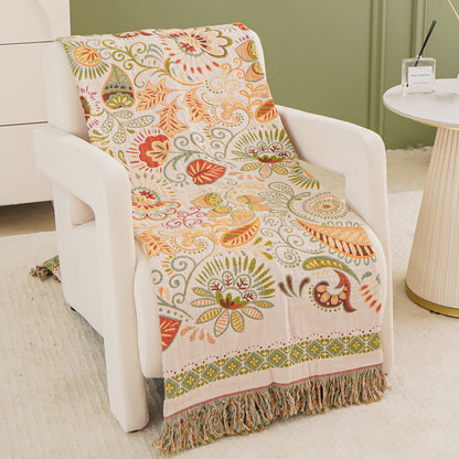 Coperta in garza di cotone con motivo paisley retrò e nappa