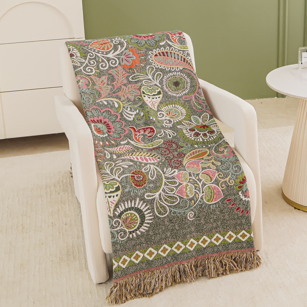 Coperta in garza di cotone con motivo paisley retrò e nappa