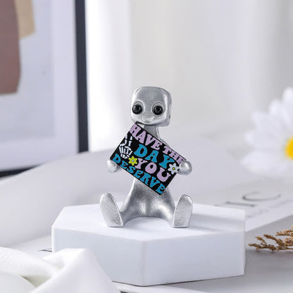 Piccola statua in resina di robot con slogan